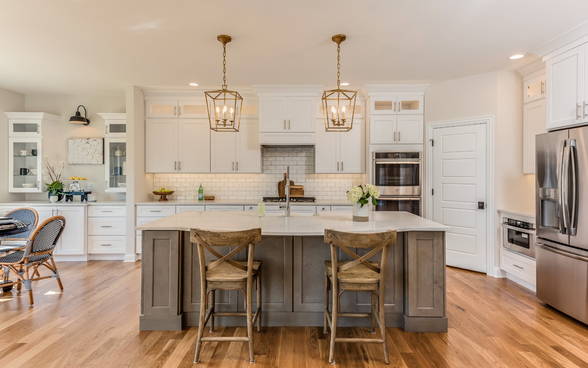 White cabinetry kitchen with contrasting island